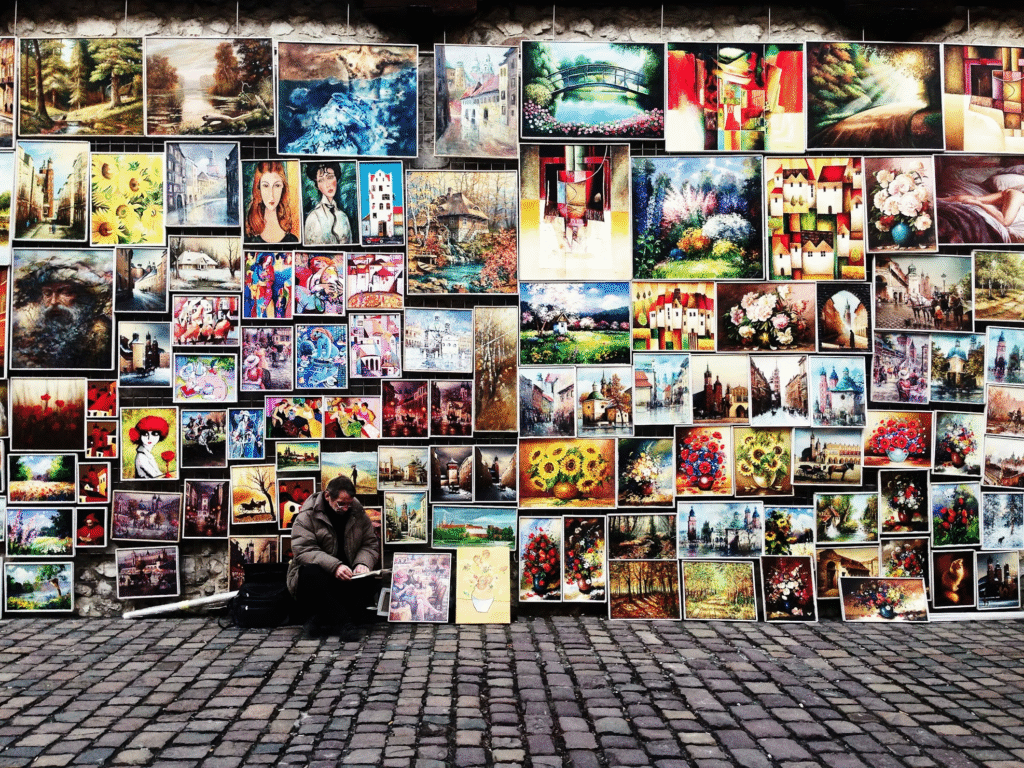 How to Make Money as an Artist Online in 2025: Full Guide 1 A display of art being sold showing how to make money as an artist online.