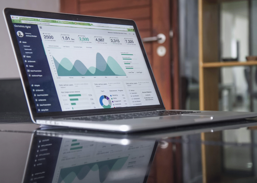 6 Reasons Why New Clothing Brands Fail (& How to Succeed) 2 An open laptop showing marketing statistics displaying why new clothing brands fail.