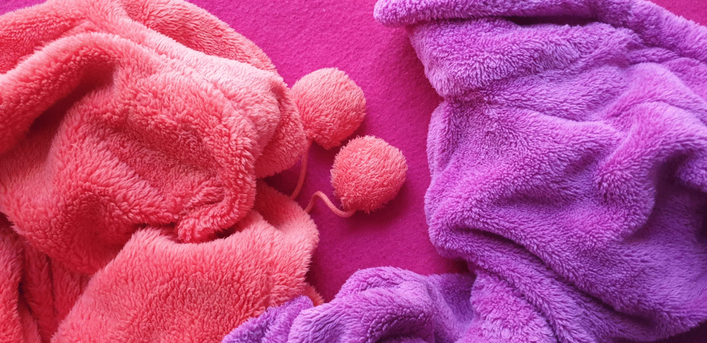 Pink and purple fleece fabric showing one of the warmest fabrics for winter.
