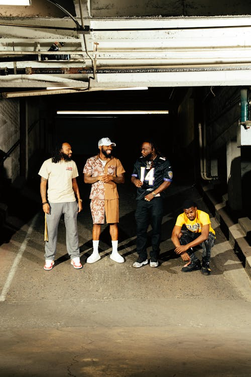 A group of African American men wearing streetwear, some of the most popular apparel styles you should know before starting a brand.