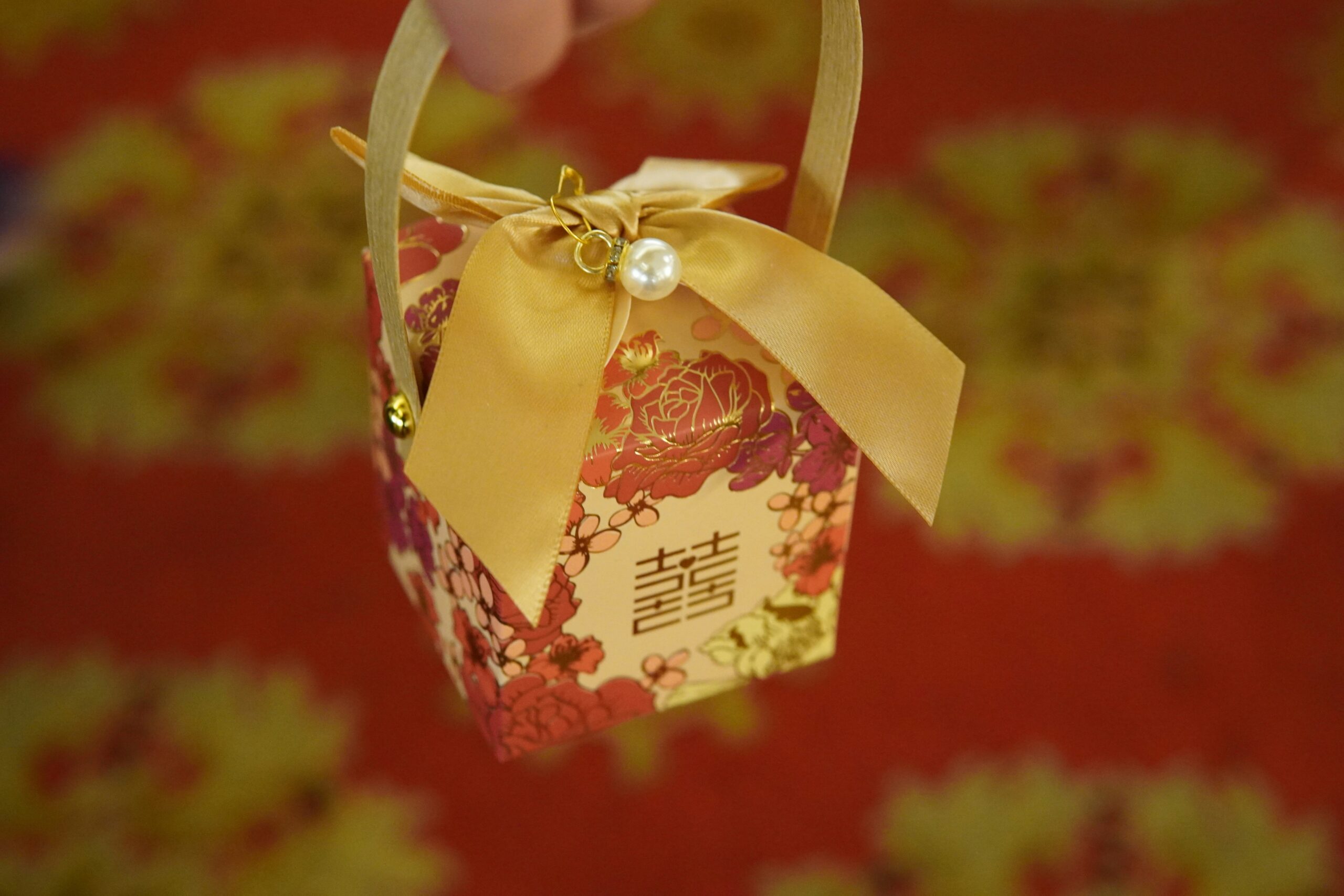 A Chinese style gift wrapped door gift idea for a Singapore event.