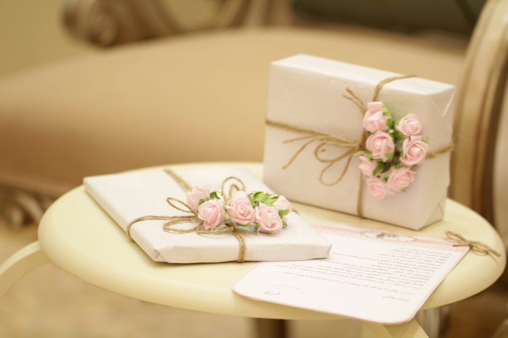 Door gift ideas for corporate events in the shape of a white box with a ribbon for a Singapore event.